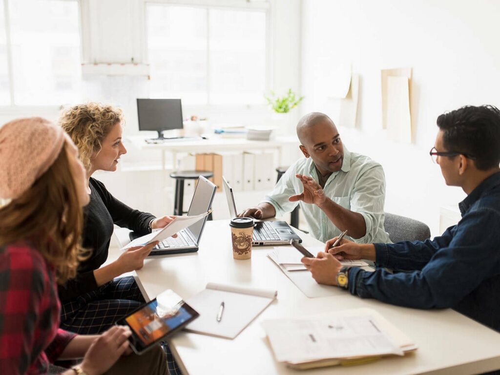 A group of peers talking to each other