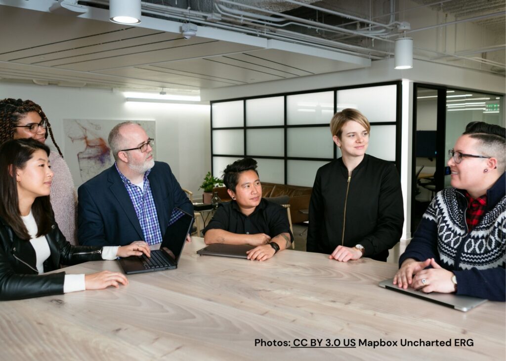A group of peers listening to a coworker