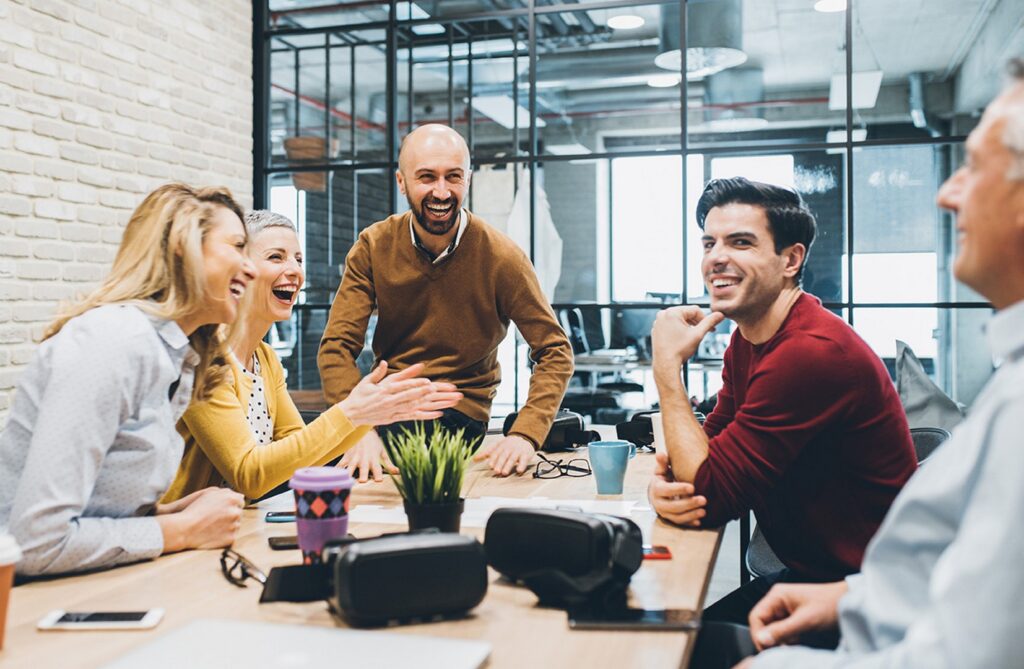 A group of peers laughing at each other