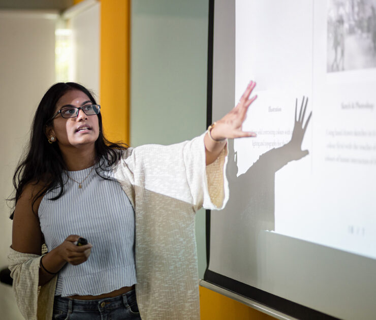 A woman presenting a topic