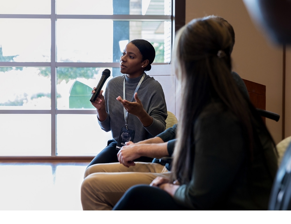 Woman speaking at a conference