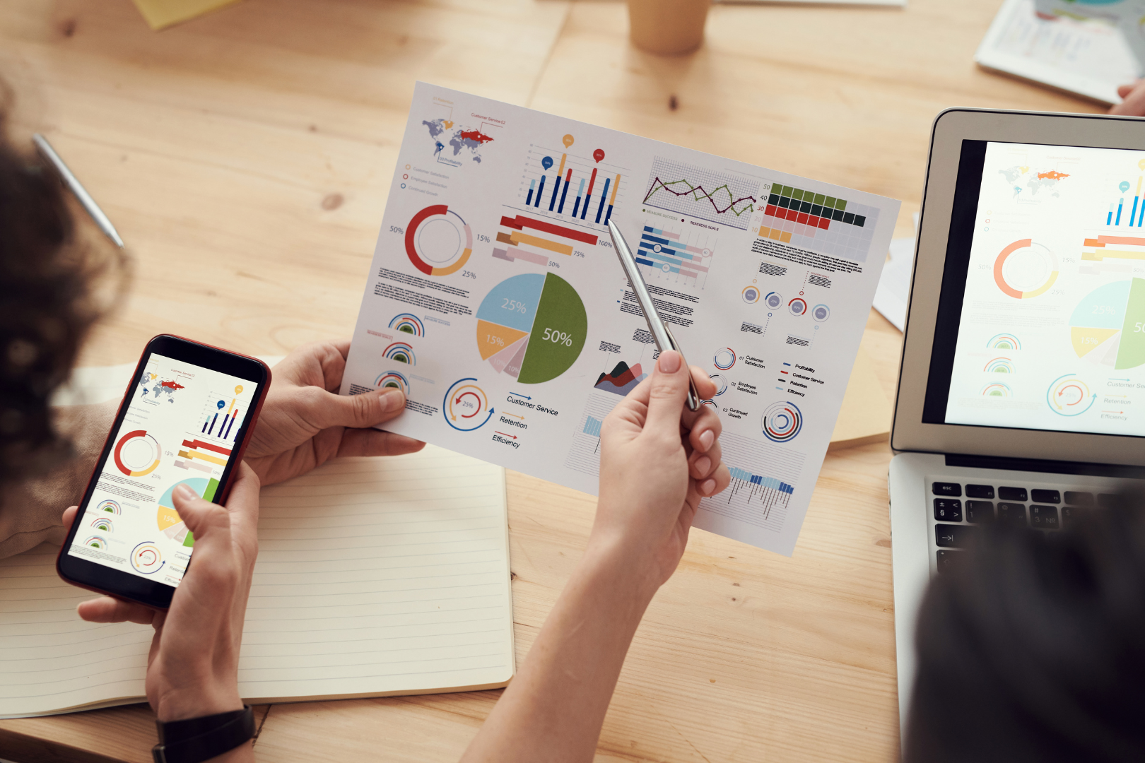 Persons looking at a graphic