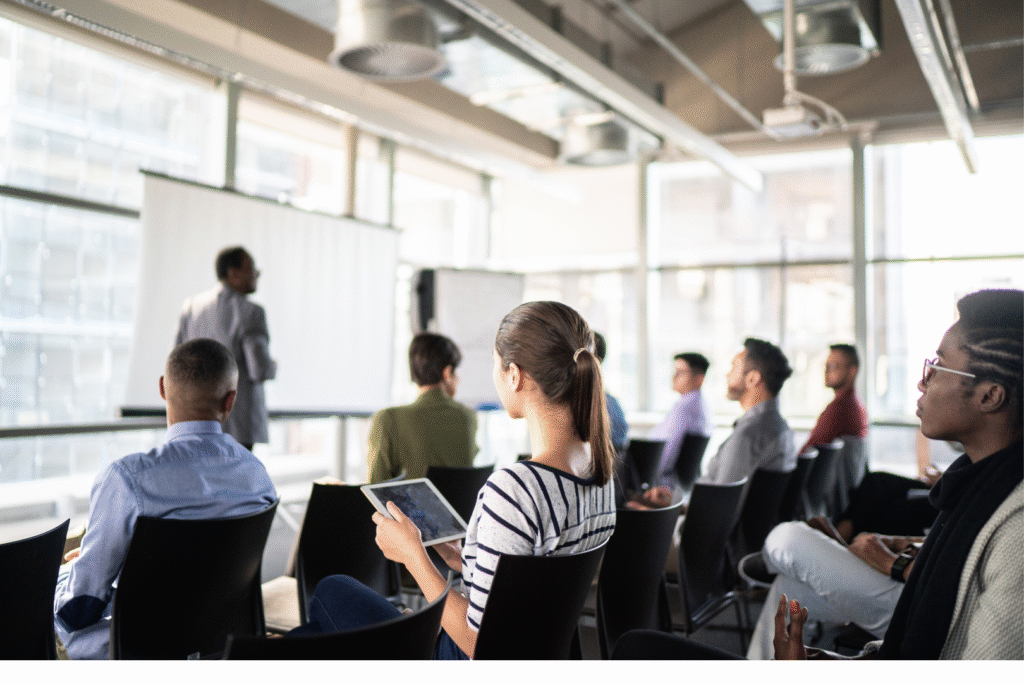 A group of people listening at a conference