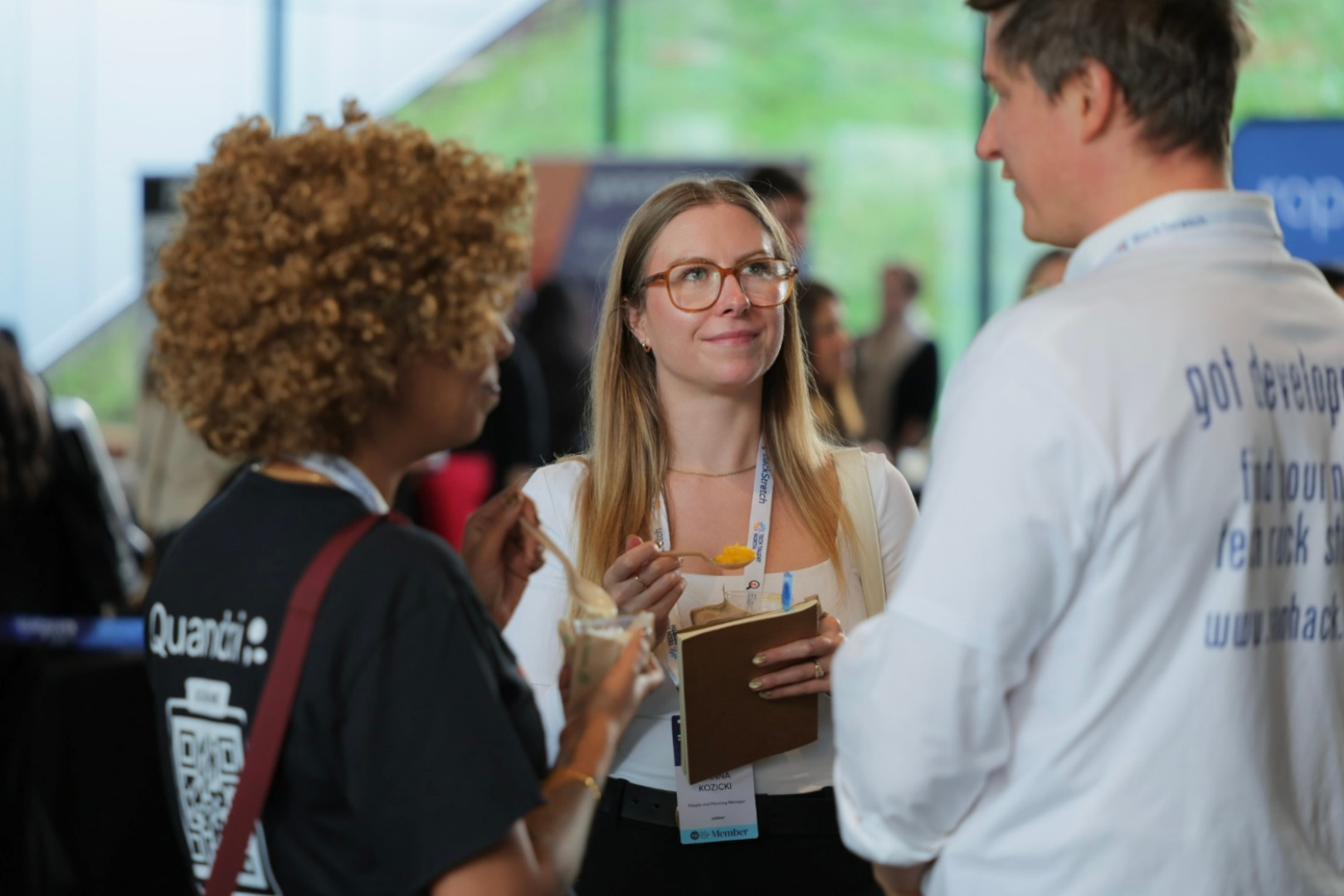 three people having a conversation and eating ice cream