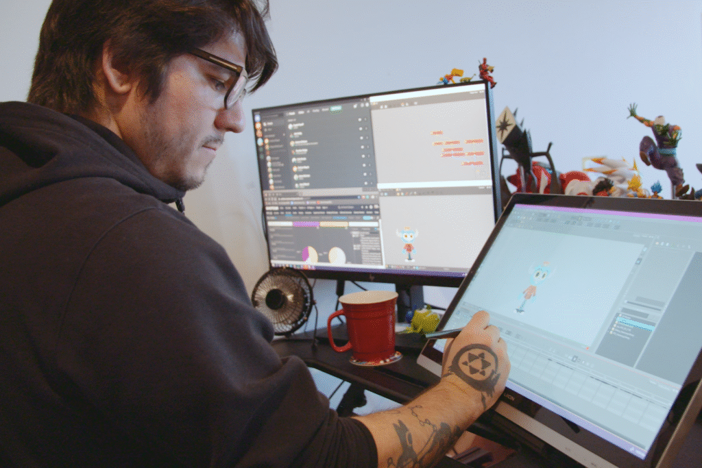 Indigenous man working at a VFX job, at his computer