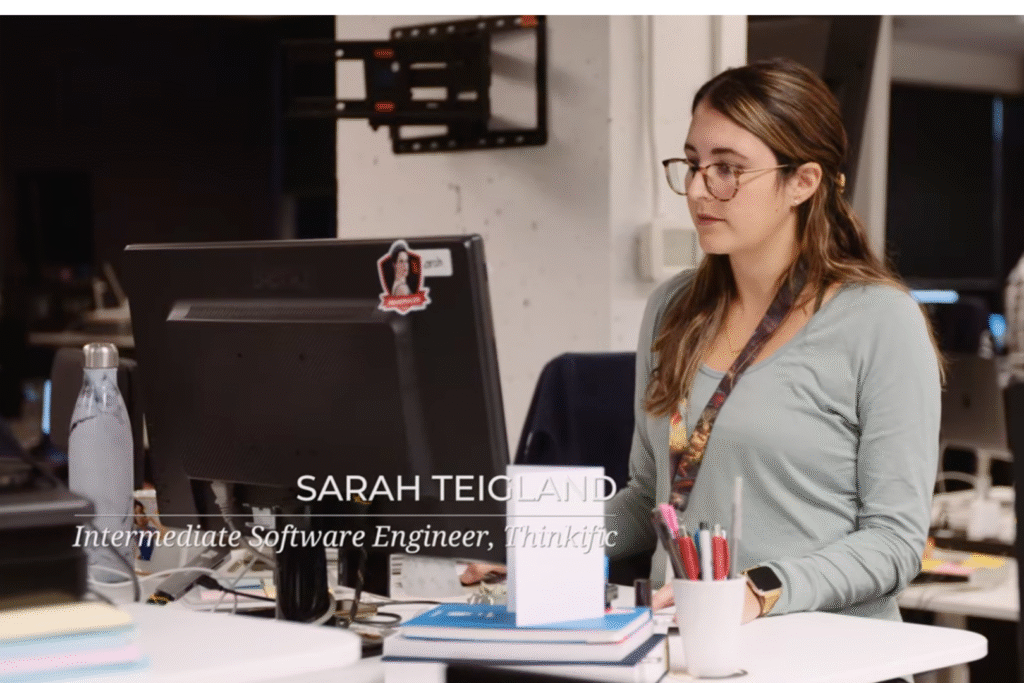 Woman working at a computer. Sarah Tiegland. Intermediate Software Developer, Thinkific