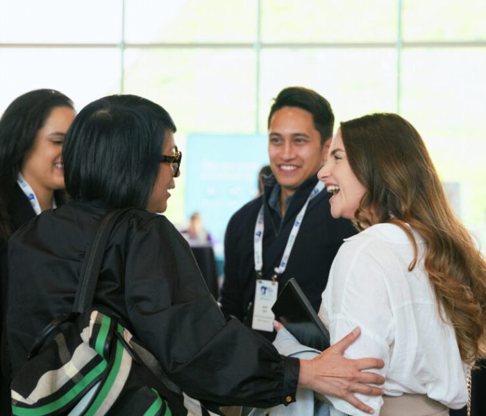 Group of coworkers smiling and talking